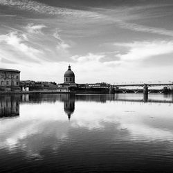 Reflection of lighthouse in water