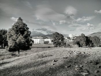 Scenic view of landscape against cloudy sky