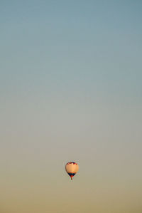 Low angle view of hot air balloon against clear sky