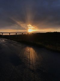 Scenic view of road against sky during sunset