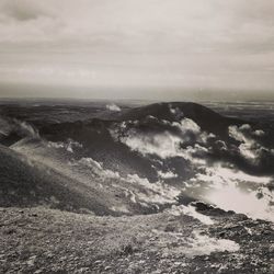 Scenic view of landscape against cloudy sky