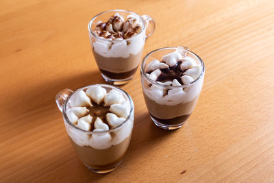 Assortment of mini chocolate desserts in the glass. mini choloate desserts on a rustic background