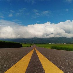 Road amidst landscape against sky