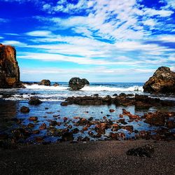 Scenic view of sea against blue sky