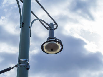 Low angle view of metal against sky