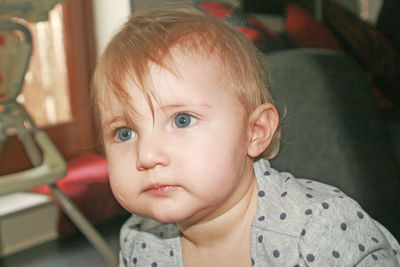 Close-up portrait of cute baby at home