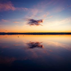 Scenic view of lake against romantic sky at sunset