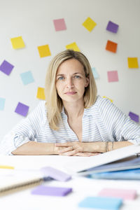 Portrait of businesswoman sitting at office