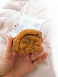Midsection of person holding cookies