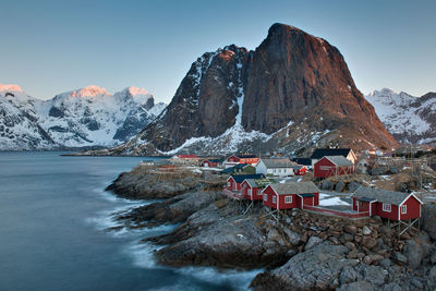 Scenic view of sea and mountains against sky