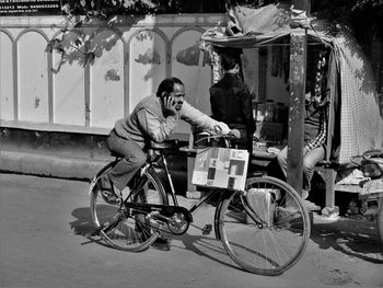 Man cycling bicycle in city