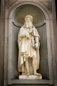 Statue against wall