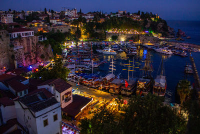 High angle view of illuminated buildings in city at night