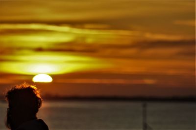 Portrait of silhouette man on beach during sunset