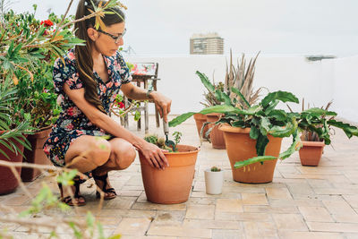 Woman gardening on terrace