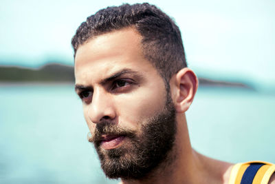 Close-up of thoughtful young man looking away