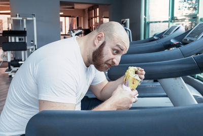 Midsection of man eating food