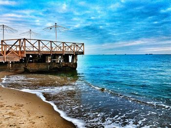 Pier over sea against sky