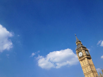 Low angle view of tower against blue sky