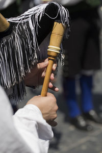 Close-up of people holding metal