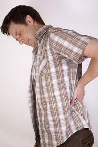 Side view of senior man against white background