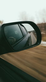 Reflection of car on side-view mirror