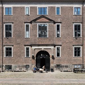 People sitting outside building