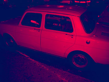 Car parked on road at night