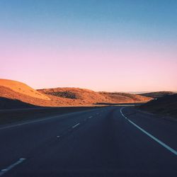 Empty road along landscape