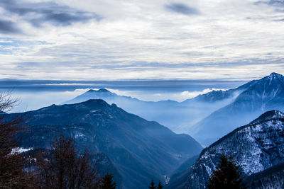 Scenic view of snowcapped mountains against sky