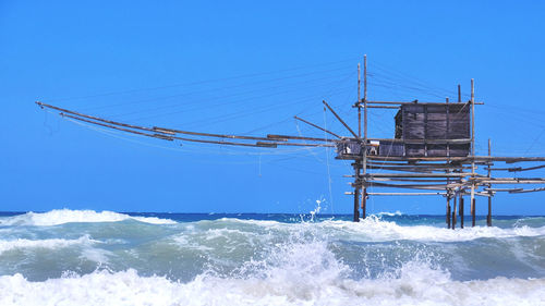 Scenic view of sea against clear blue sky