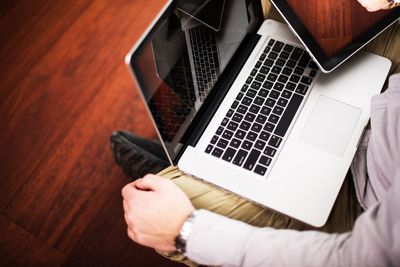 High angle view of man using laptop on table