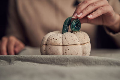 Close-up of hand holding ice cream