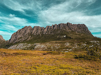 Scenic view of rocks on land against sky