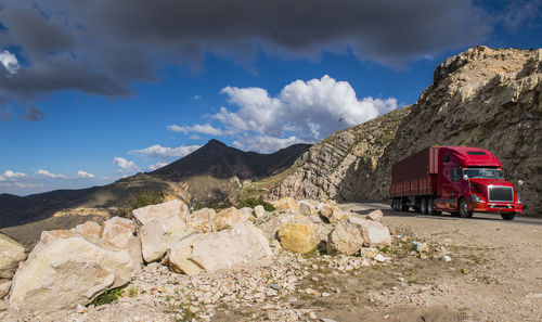 Red truck driving up a hill in bolivia