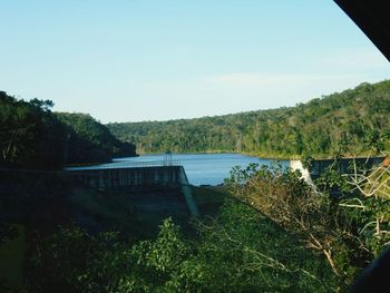 Scenic view of calm lake against sky