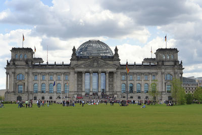 Group of people in front of historical building