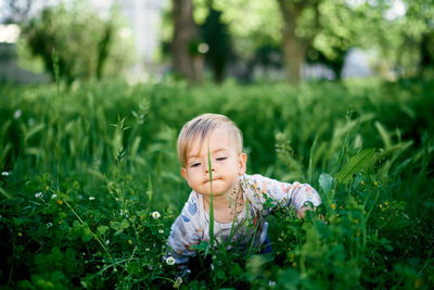 Portrait of cute girl on field