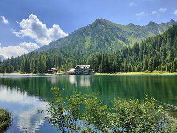 Scenic view of lake and mountains against sky