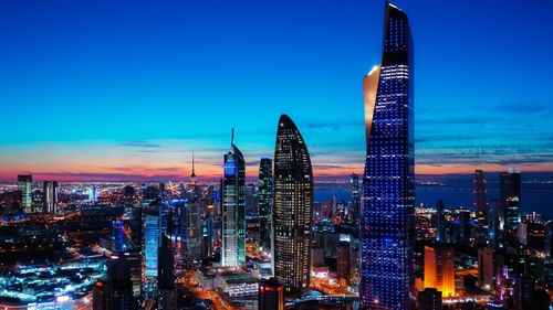 Illuminated buildings in city at night