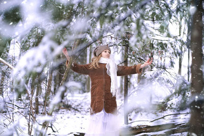 Cute girl standing outdoors during winter