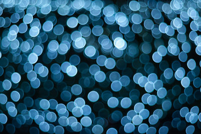 Defocused image of illuminated lights at night