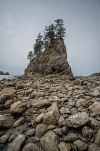 Low angle view of rock formation against sky