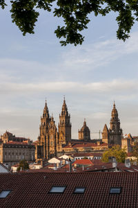 View of buildings against cloudy sky