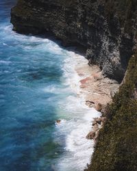 High angle view of rocks at sea shore