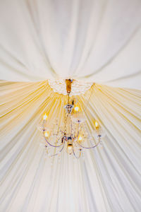 Low angle view of illuminated chandelier