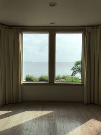 Scenic view of sea seen through window