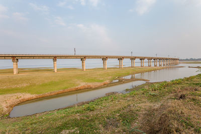 Bridge over river against sky