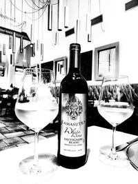 Close-up of wine bottles on table in restaurant