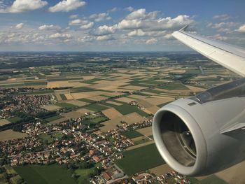 Cropped image of airplane over landscape